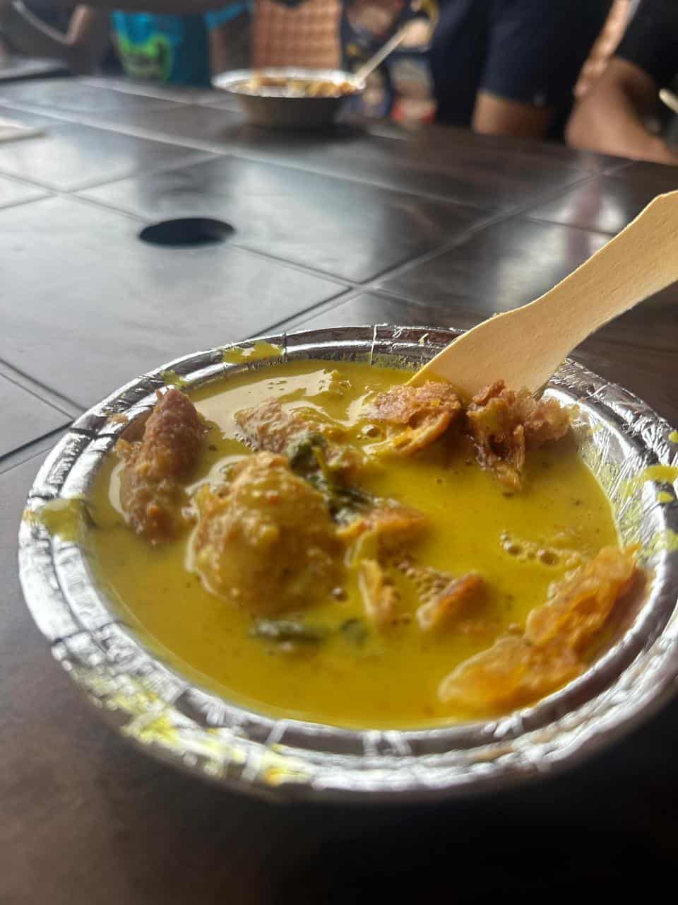 Kadhi Pakora served in a foil bowl